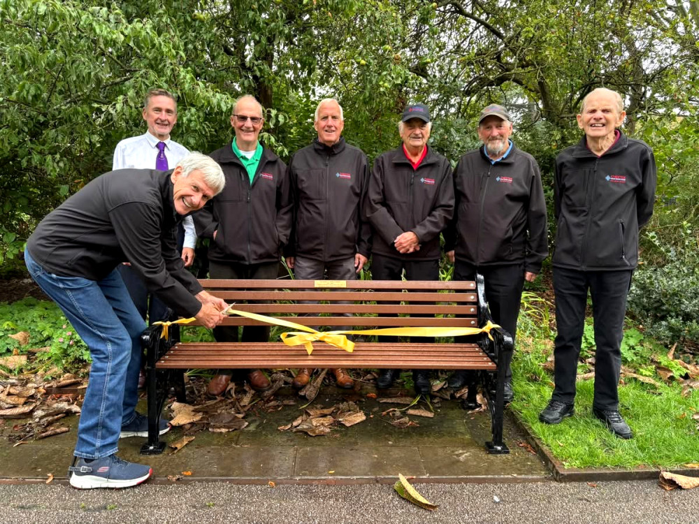 Richard Marks, chair of Chester Male Voice Choir, cuts the ribbon on the new Fred Warren memorial bench in Chester's Grosvenor Park (Image: Chester Male Voice Choir)