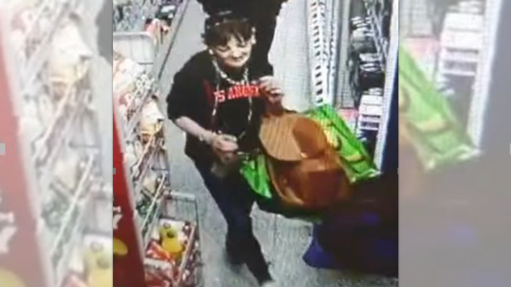 Police would like to speak with the woman in the picture as they believe she could help in their enquiries (Image via GMP)