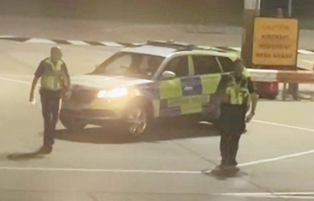 Police officers met the flight when it landed (image via SWNS)