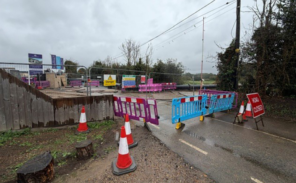 The scene at the closure on Walton's Hall Road. 
