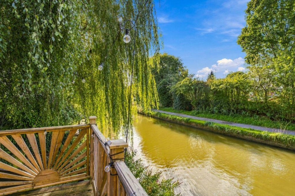 Our friends and sponsors at Julian Wadden present this 'rare' opportunity to buy this lovely three-bedroom link-detached canalside home in Marple (Image - Julian Wadden)