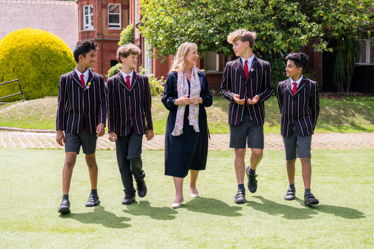 Shrewsbury House School Executive Headteacher Joanna Hubbard with pupils in the school grounds (Credit: Shrewsbury House School)