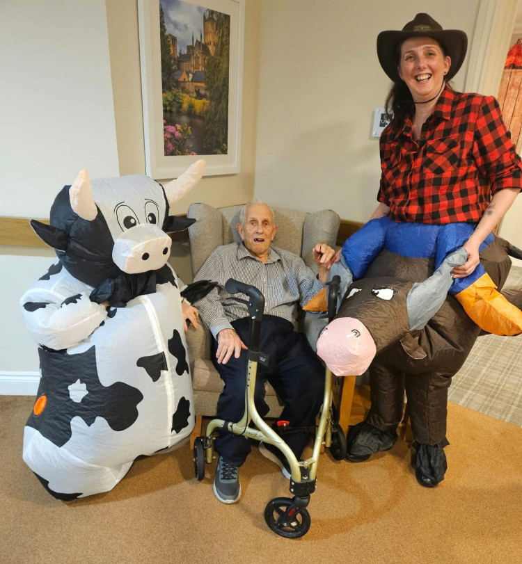 Crandon Springs Care Home resident and former farmer Neville, enjoyed meeting the inflatable cow at the home's Wild West Day.