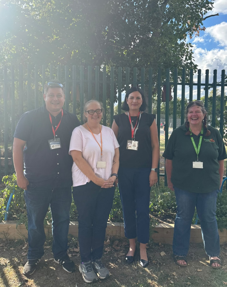 Cllr Milena Bingley (second from the right) with staff at Quarry Hill Academy.
