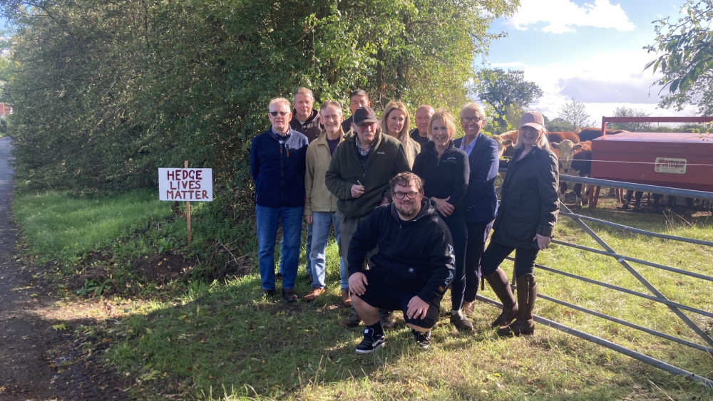 Residents and cllrs Andrew Adams And Chris Large at Levedale Road, Levedale, on land earmarked for a visibility splay for the entrance to the solar farm (image via Kerry Ashdown)