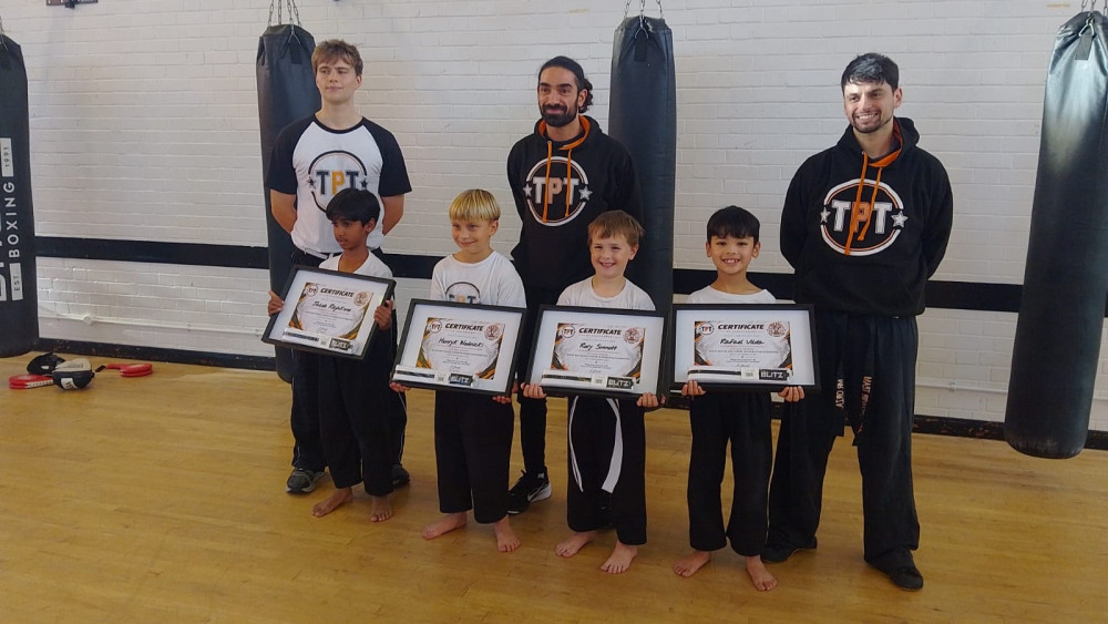 Total Power Team boys receiving their junior kickboxing black belts (credit: Image supplied).