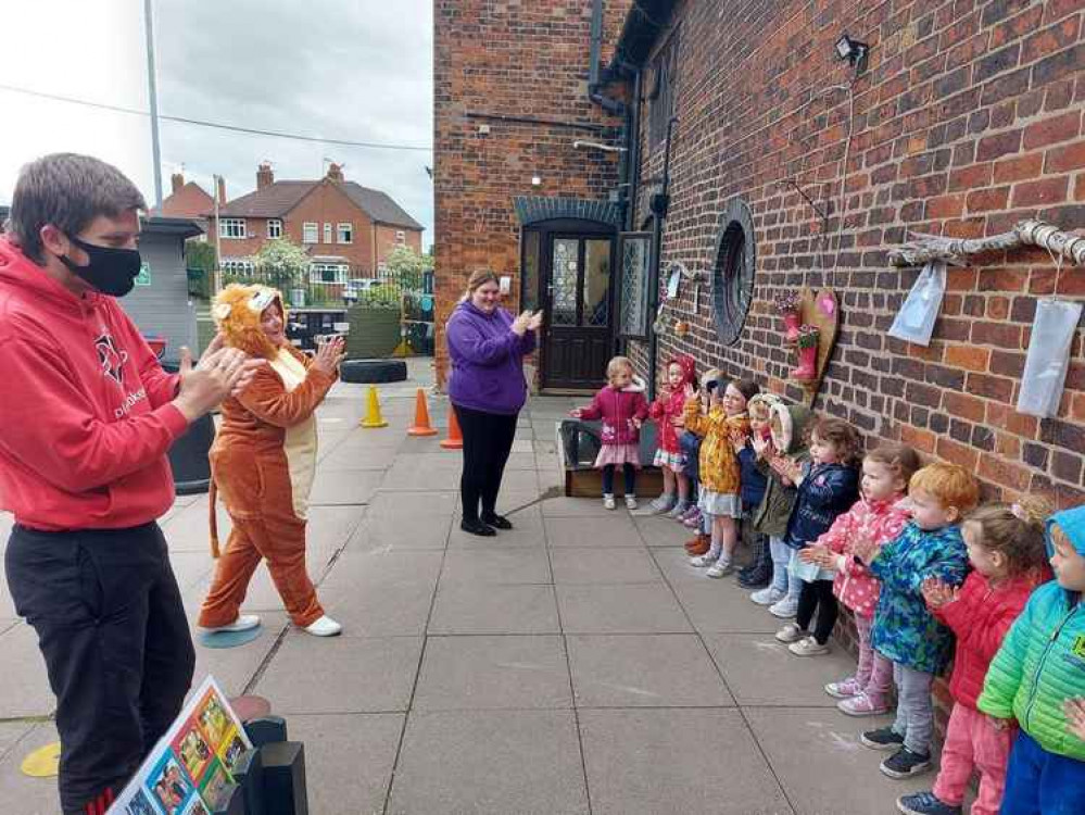 Townhouse Mighty Lions from Audley Road nursery singing 'It's Coming Home' alongside Mr Ross, Julie Henshall and Carly Dugmore Townhouse Mighty Lions from Audley Road nursery singing 'It's Coming Home' alongside Mr Ross, Julie Henshall and Carly Dugmore
