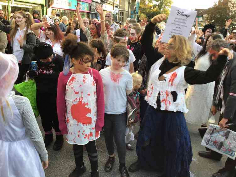 Crowds of zombies await release by the town crier