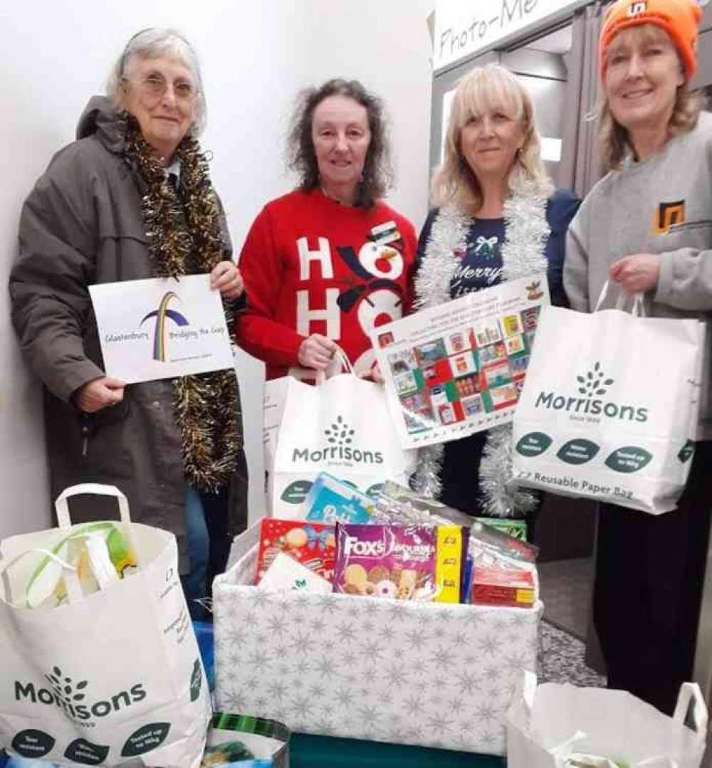 Jaqueline (Food Bank), Alison (Morrisons Community Champion), Jenny and Sue (Melhuish & Saunders) with food donations from Landmark House businesses