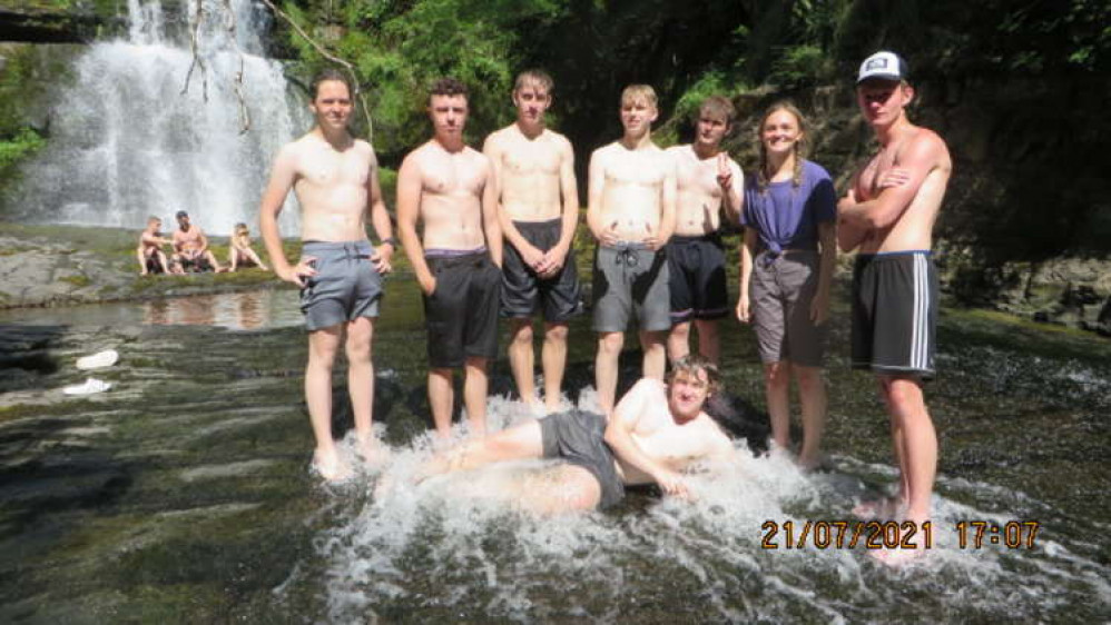 Bathing at the waterfall