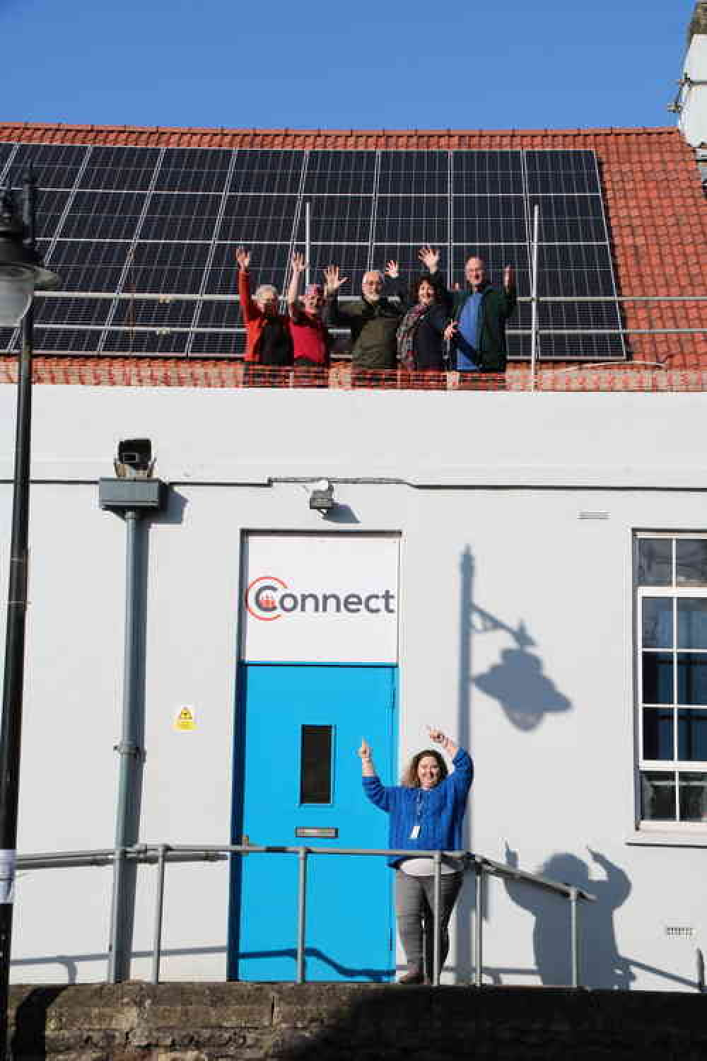 Connect Centre staff and supporters celebrate the installation of their solar panel array (Photo: Philip Welch)