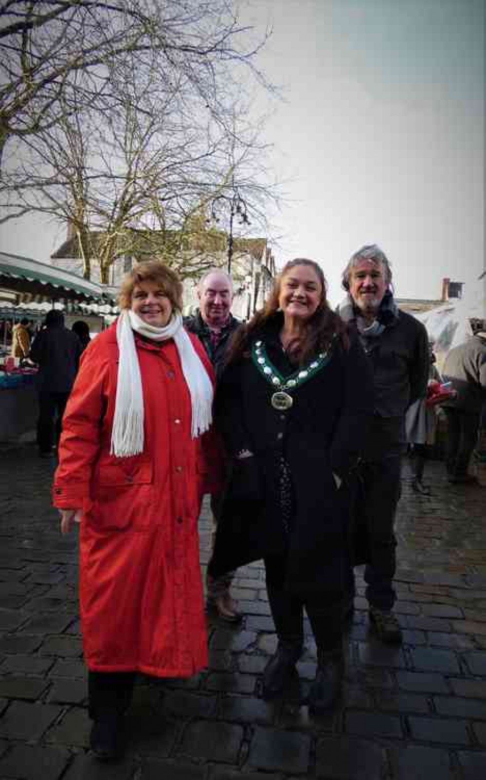 Mendip councillors join the crowds at the official opening of the Wells at Christmas market, from left, leader of Mendip District Council, Cllr Ros Wyke; Cllr Nick Cottle, portfolio holder for neighbourhood services; chair of Mendip District Council, Cllr