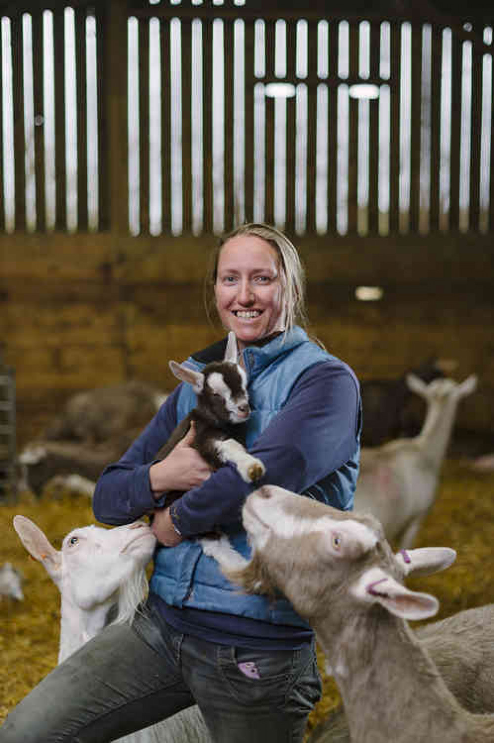 Sarah Davies with the farm's goats