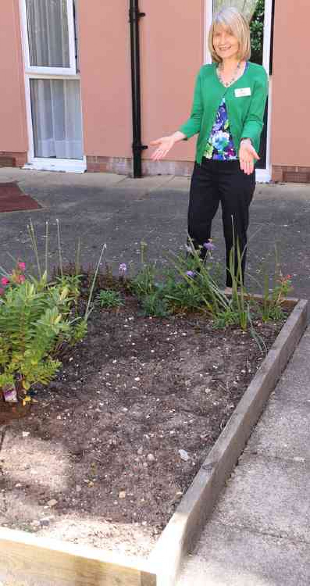 Julie with another empty flower bed at Torrwood