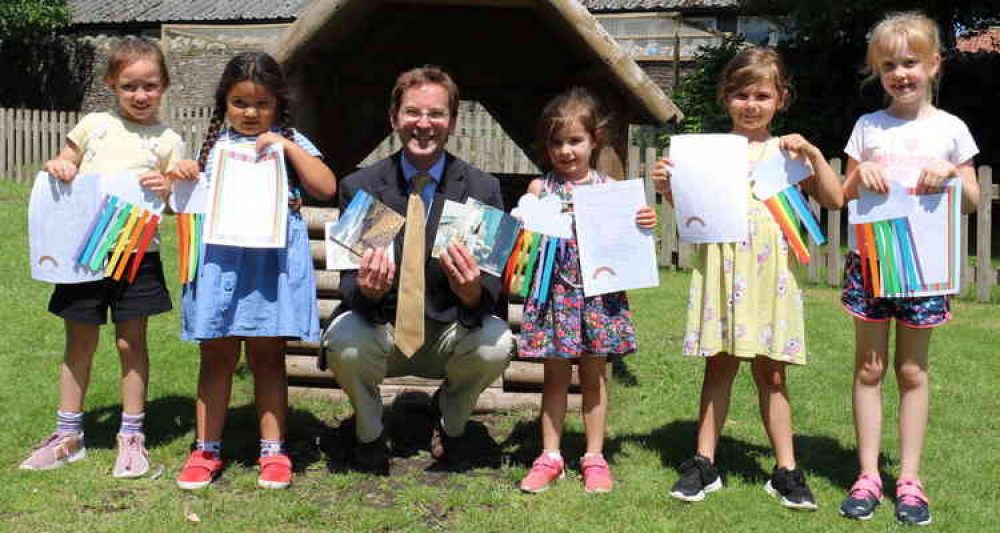 Head master Alastair Tighe with pre-prep pupils and their letters