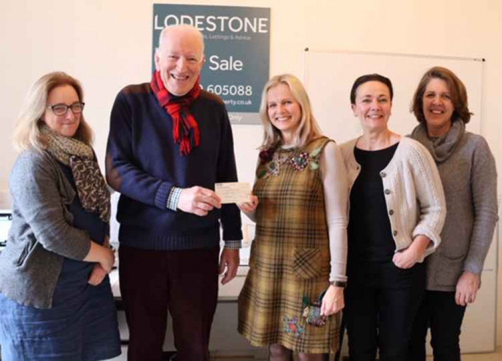 Ross Young accepts Lodestone's sponsorship cheque at their Wells office. The photo was taken just before lockdown