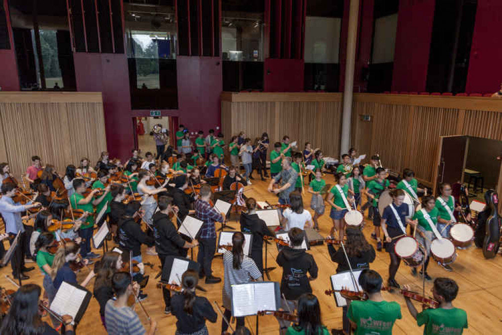 Chales Hazlewood leads an experimental workshop, organised by TIME, for young musicians in Cedars Hall, Wells