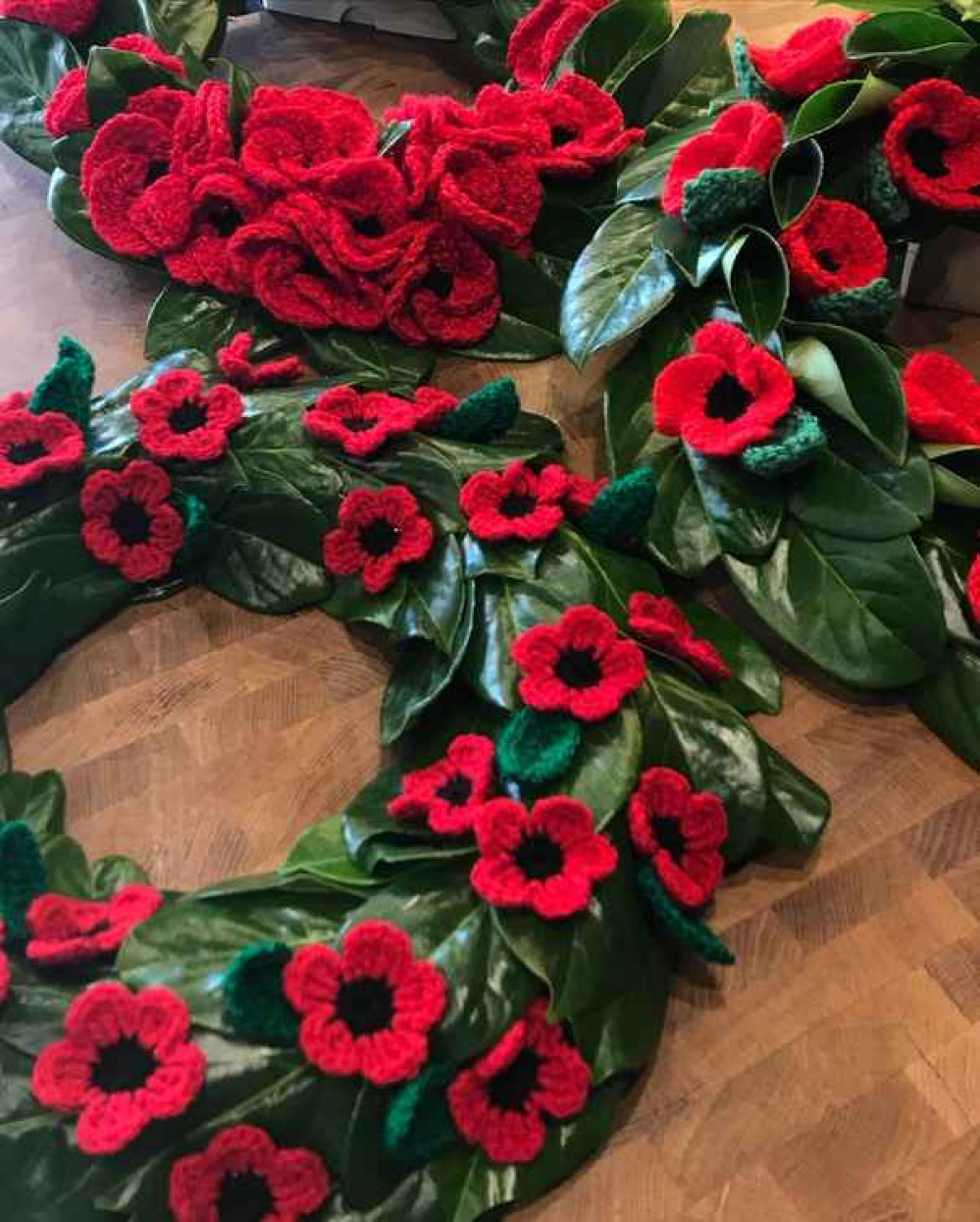 Wreaths of woollen poppies created by Abundiflora, Glastonbury