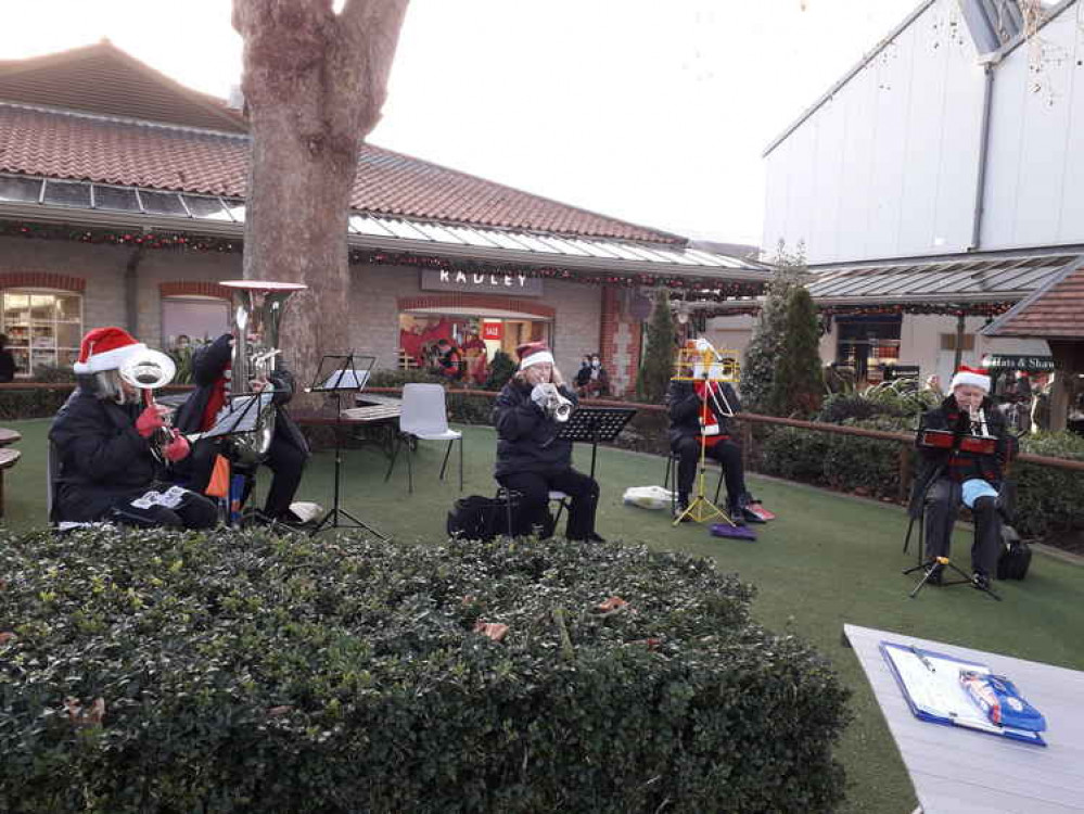 Hardy Wells City Band players entertaining the Christmas crowds at Clarks Village